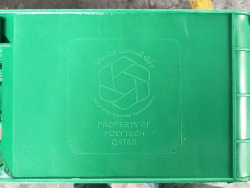 Customized full perimeter plastic pallet with engraved logo for traceability and ownership identification during global shipping.