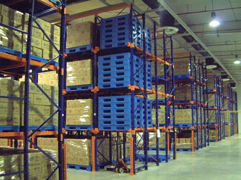 Steel-reinforced pallet stacked with heavy goods on industrial racking system