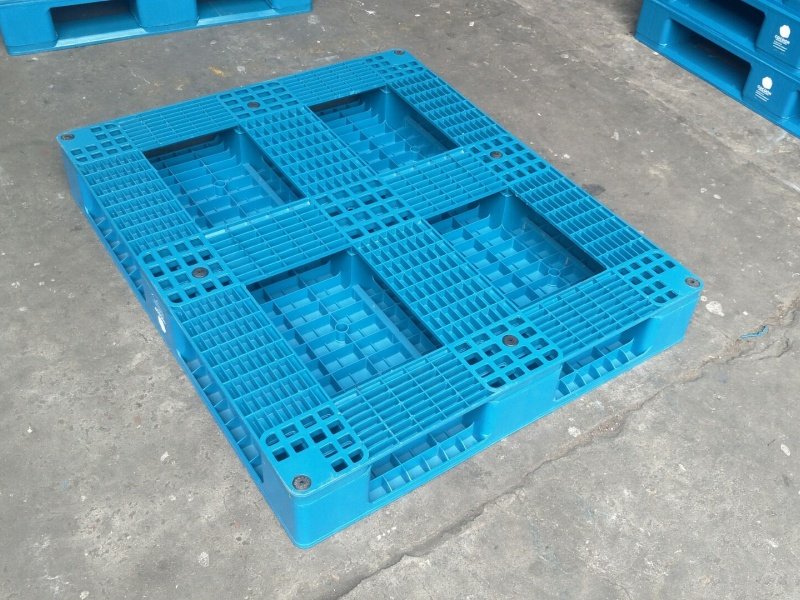 Blue full perimeter 6 runners plastic pallet with reinforced bottom runners for rack stability and uniform stacking support.